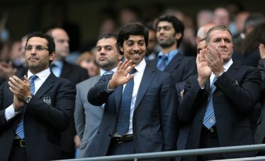 Sheik Mansour bin Zayed al-Nahyan, center, whose private investment group owns Manchester City in the English Premier League is looking to expand to Major League Soccer.